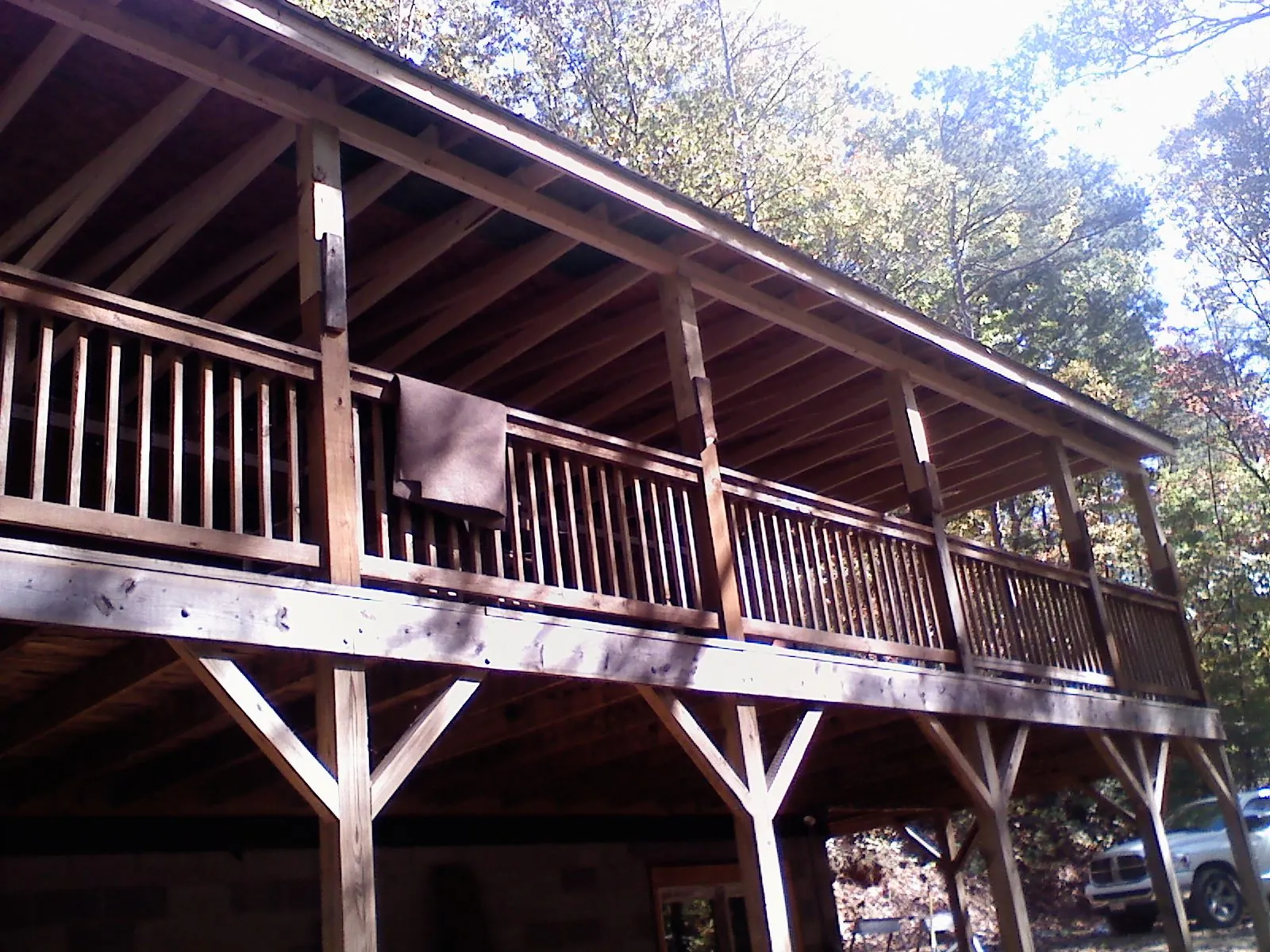 Timber framing under a new elevated porch and deck — Roof Leak Repair in Doucette by Roofing Brothers